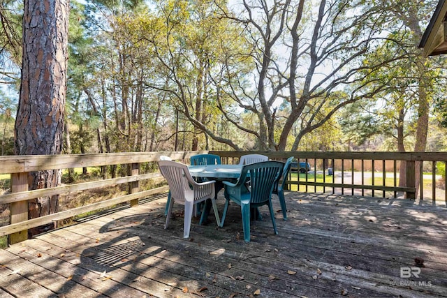 wooden deck featuring outdoor dining space