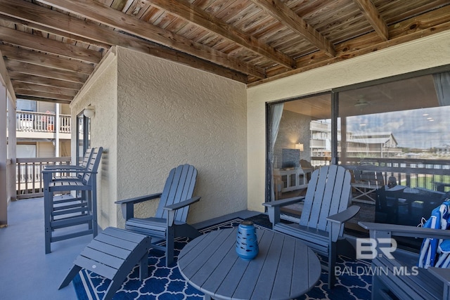 view of patio featuring a balcony