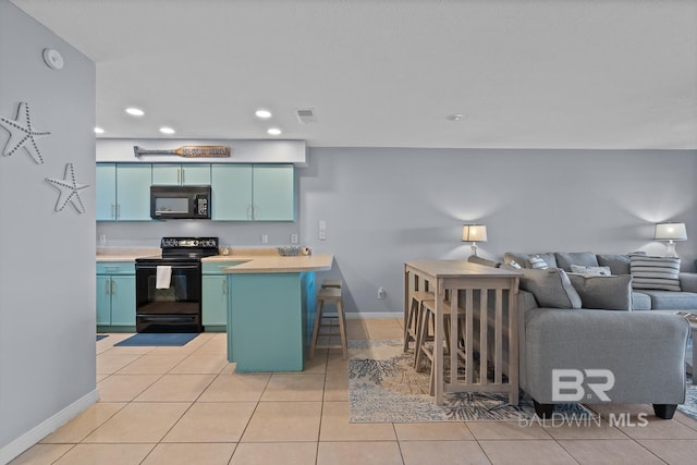 kitchen with visible vents, light tile patterned floors, a peninsula, recessed lighting, and black appliances