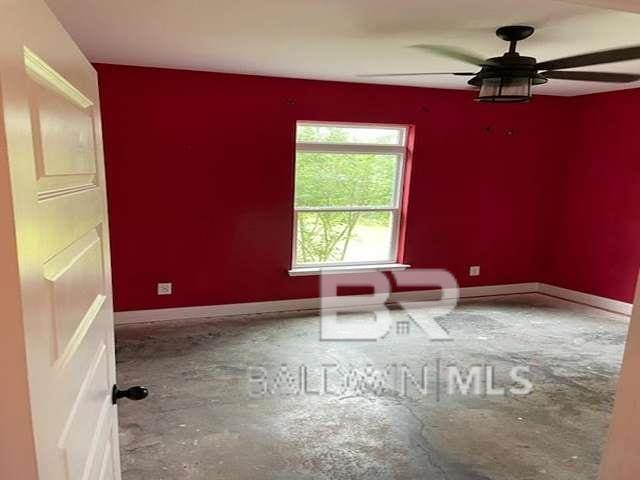 21800 Old Brady Rd, Robertsdale, AL 36567 - spare room with ceiling fan, unfinished concrete flooring, and baseboards