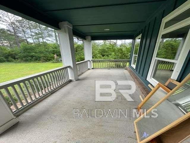 21800 Old Brady Rd, Robertsdale, AL 36567 - covered porch with a yard