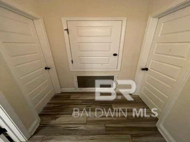 21800 Old Brady Rd, Robertsdale, AL 36567 - hallway featuring wood finished floors and baseboards