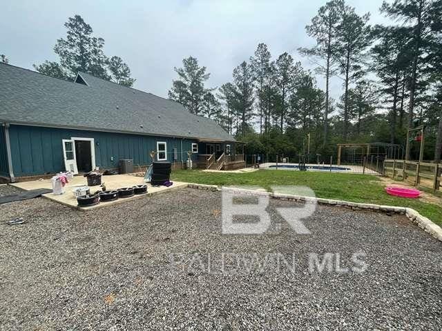 21800 Old Brady Rd, Robertsdale, AL 36567 - view of yard featuring a patio, a wooden deck, and cooling unit