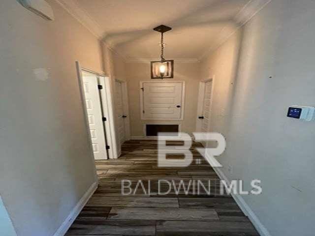 21800 Old Brady Rd, Robertsdale, AL 36567 - hallway featuring ornamental molding, wood finished floors, and baseboards
