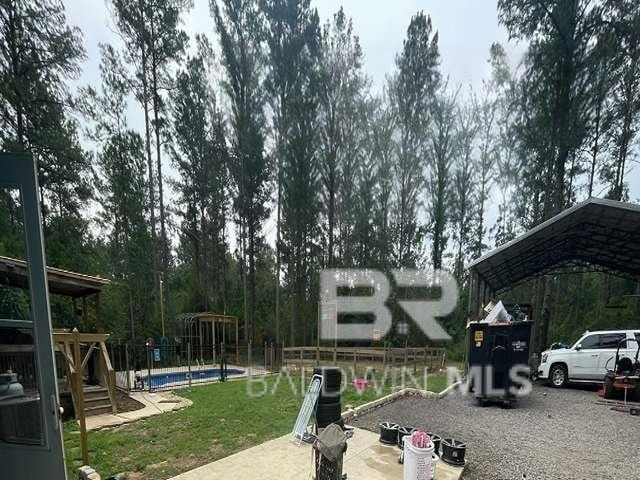 21800 Old Brady Rd, Robertsdale, AL 36567 - view of yard featuring a detached carport