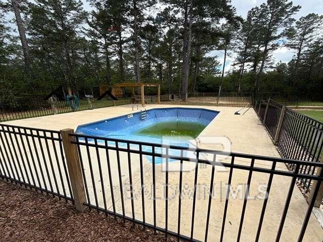 21800 Old Brady Rd, Robertsdale, AL 36567 - view of pool featuring view of wooded area and a patio area