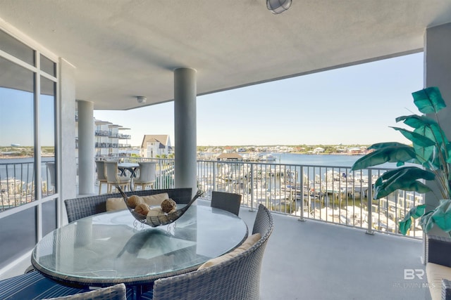27405 Polaris St Unit 302, Orange Beach, AL 36561 - balcony featuring a water view and outdoor dining space