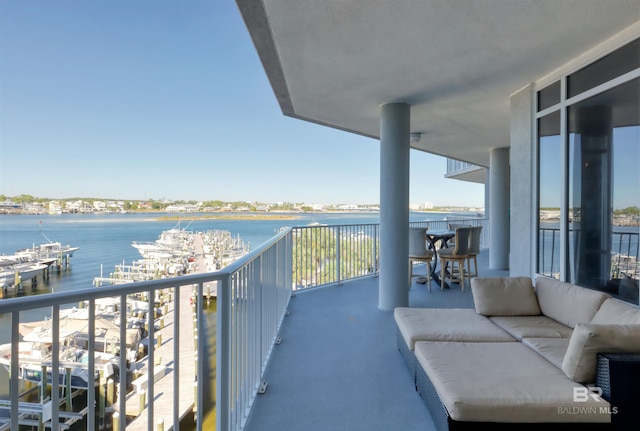 27405 Polaris St Unit 302, Orange Beach, AL 36561 - balcony with a water view and an outdoor hangout area
