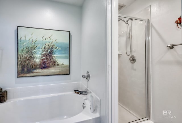 27405 Polaris St Unit 302, Orange Beach, AL 36561 - full bathroom with a stall shower and a garden tub