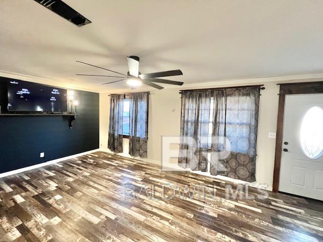 foyer featuring wood-type flooring and ceiling fan