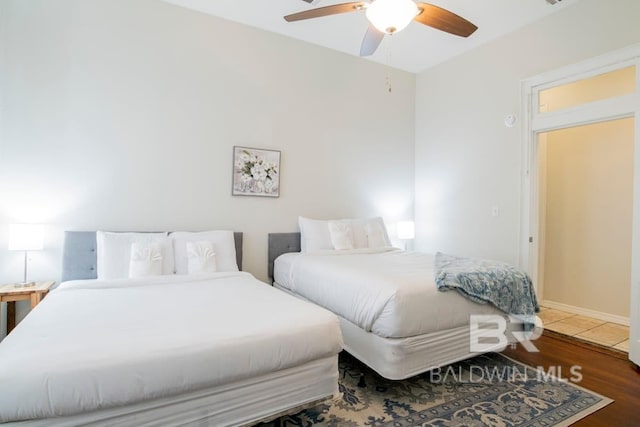 bedroom featuring ceiling fan and hardwood / wood-style floors