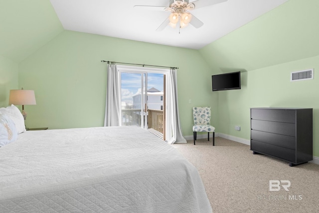carpeted bedroom with lofted ceiling, baseboards, visible vents, access to exterior, and ceiling fan