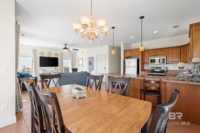 dining area with recessed lighting, light tile patterned floors, visible vents, and ceiling fan with notable chandelier