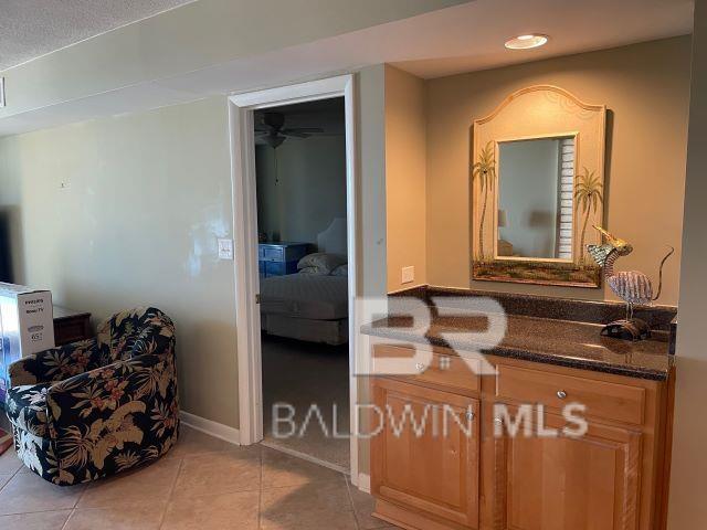 bathroom featuring tile patterned flooring and vanity