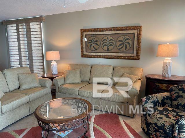 living room featuring a textured ceiling