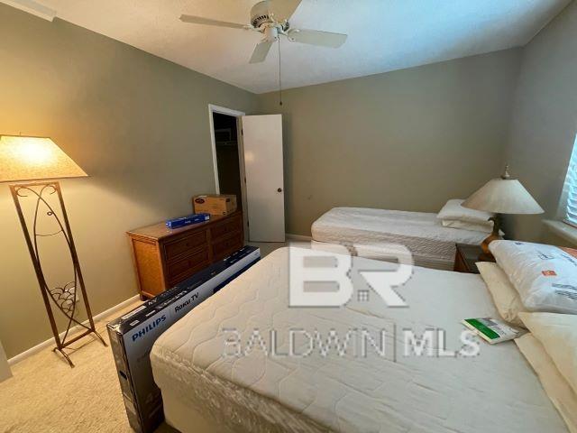 bedroom with light colored carpet and ceiling fan