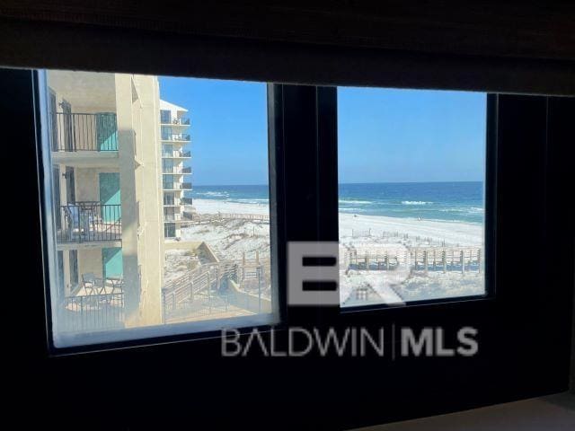 room details with a view of the beach and a water view