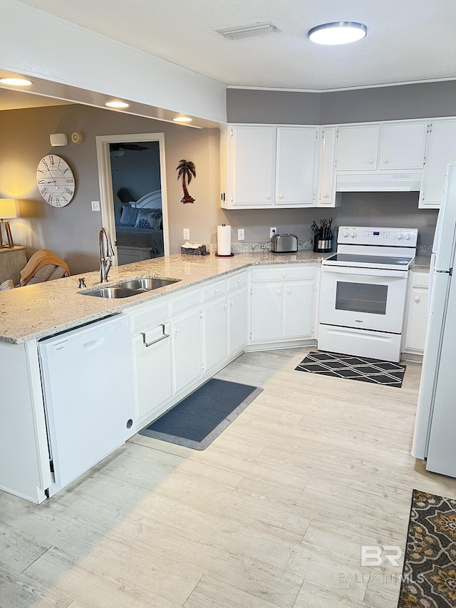 9581 S Bay Rd, Foley, AL 36535 - kitchen featuring sink, white cabinets, white appliances, and kitchen peninsula