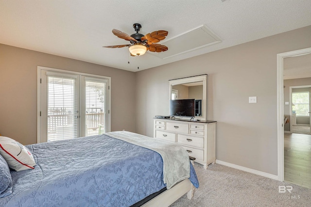 9581 S Bay Rd, Foley, AL 36535 - bedroom with multiple windows, light carpet, access to outside, and ceiling fan