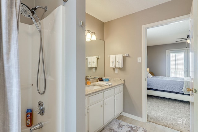 9581 S Bay Rd, Foley, AL 36535 - bathroom featuring hardwood / wood-style flooring, vanity, shower / bath combination, and ceiling fan