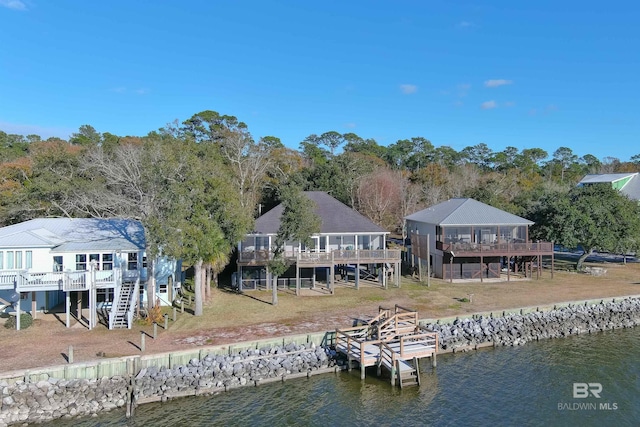 9581 S Bay Rd, Foley, AL 36535 - rear view of house featuring a deck with water view and a yard