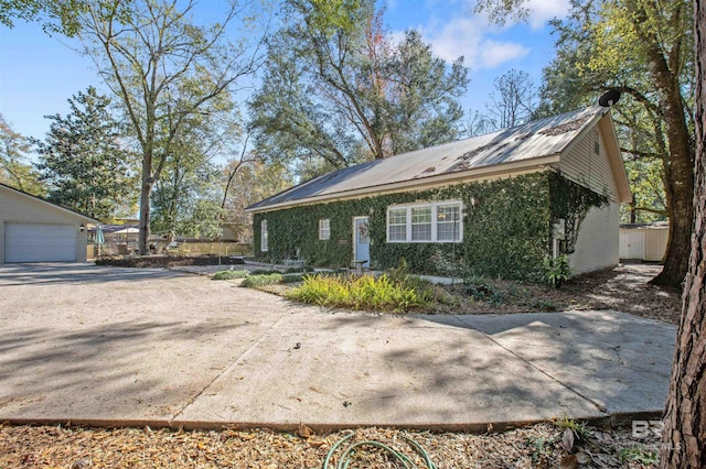 view of side of home with a garage