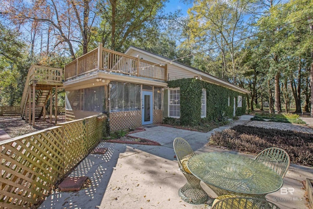 view of front of house featuring a patio area and a sunroom