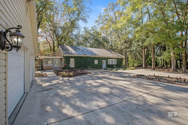 view of side of home with a garage