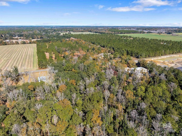 aerial view with a rural view and a wooded view