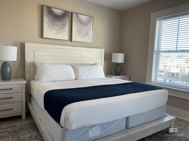 bedroom featuring dark hardwood / wood-style floors