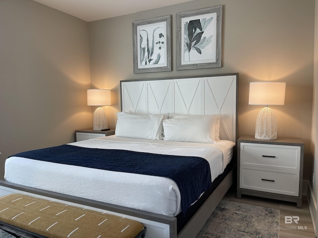 bedroom with wood finished floors