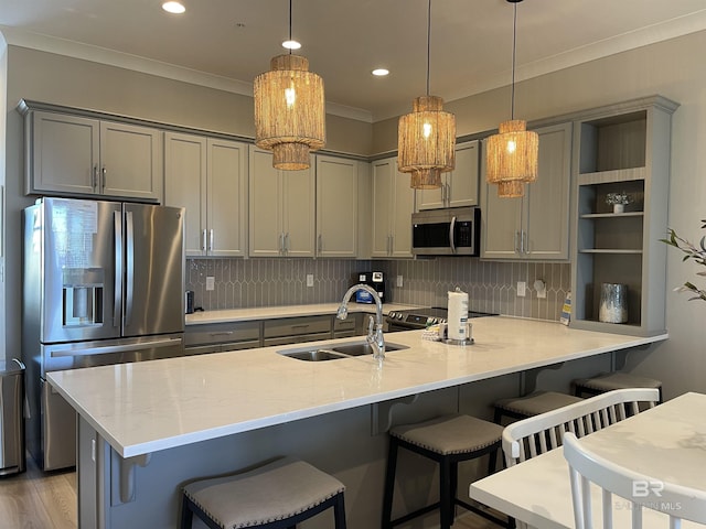kitchen featuring open shelves, a sink, decorative backsplash, stainless steel appliances, and gray cabinetry