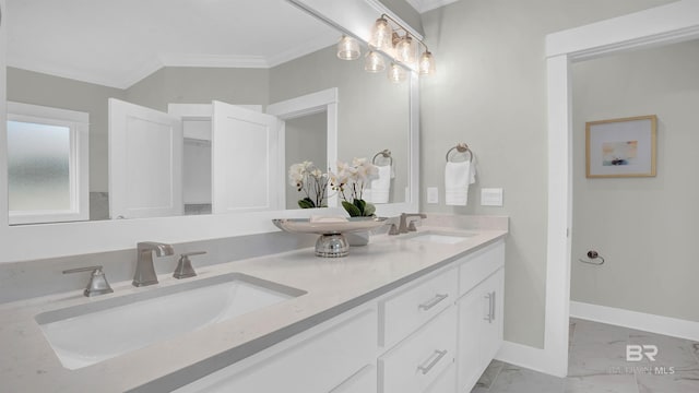 bathroom with crown molding and vanity