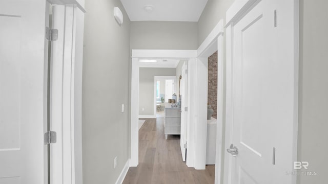 hall with light wood-type flooring