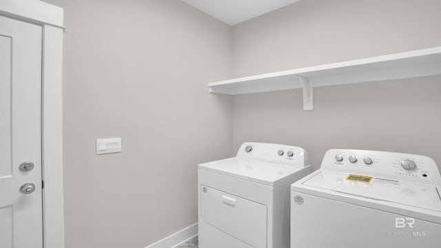 laundry area with washing machine and clothes dryer