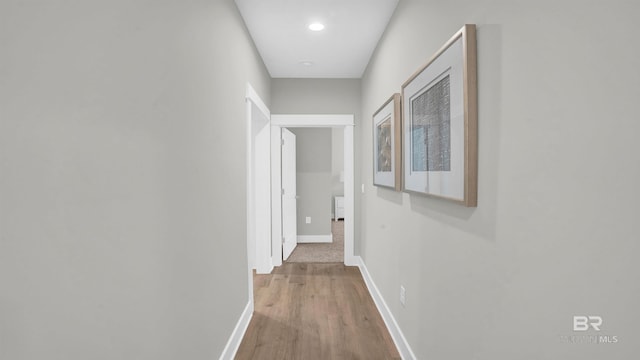 hall with hardwood / wood-style floors