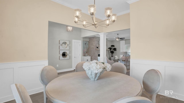 dining area with ceiling fan with notable chandelier, ornamental molding, decorative columns, and wood-type flooring