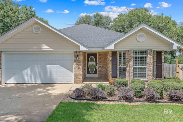 11097 Pontchartrain Loop, Daphne, AL 36526 - ranch-style house featuring a shingled roof, concrete driveway, an attached garage, and stone siding