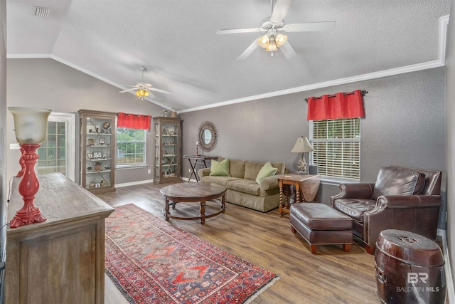 11097 Pontchartrain Loop, Daphne, AL 36526 - living room with a ceiling fan, a textured ceiling, vaulted ceiling, wood finished floors, and ornamental molding