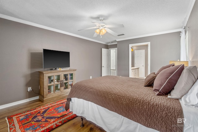 11097 Pontchartrain Loop, Daphne, AL 36526 - bedroom featuring wood finished floors, ornamental molding, a textured ceiling, a ceiling fan, and ensuite bath