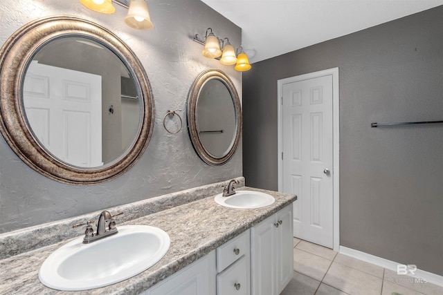 11097 Pontchartrain Loop, Daphne, AL 36526 - full bathroom with tile patterned floors, double vanity, and a textured wall