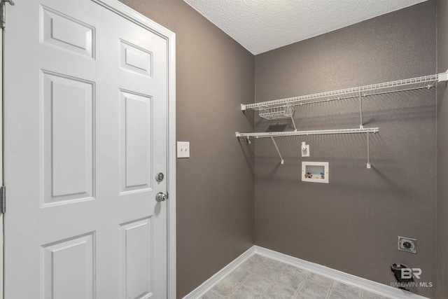11097 Pontchartrain Loop, Daphne, AL 36526 - laundry area with washer hookup, electric dryer hookup, and a textured ceiling