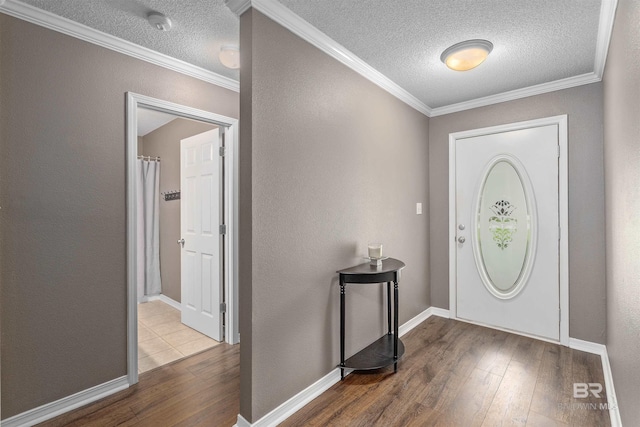 11097 Pontchartrain Loop, Daphne, AL 36526 - foyer entrance featuring hardwood / wood-style flooring, a textured ceiling, and crown molding