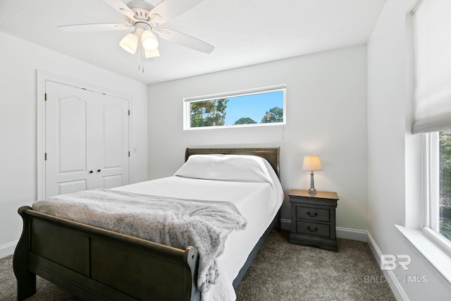 carpeted bedroom with a closet and ceiling fan