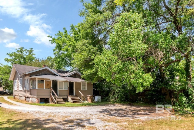 view of front of home with a chimney