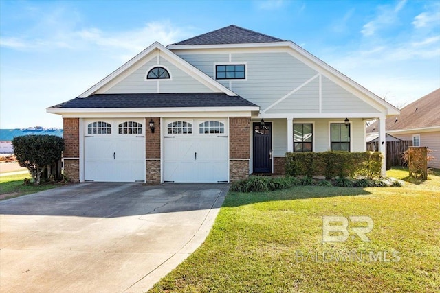 view of front facade featuring concrete driveway, a front lawn, and brick siding