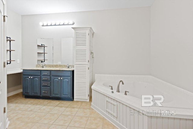 bathroom featuring vanity, a bath, and tile patterned floors