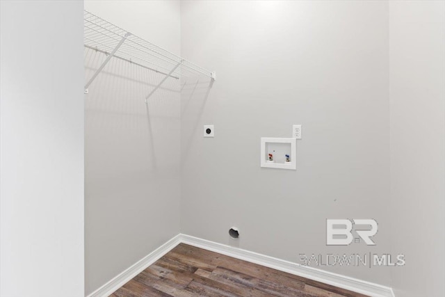 laundry area with laundry area, baseboards, dark wood finished floors, hookup for an electric dryer, and washer hookup