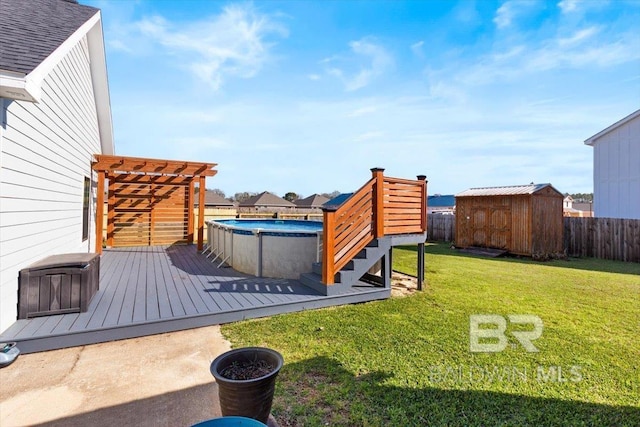 view of yard featuring an outbuilding, fence, a wooden deck, and a storage shed