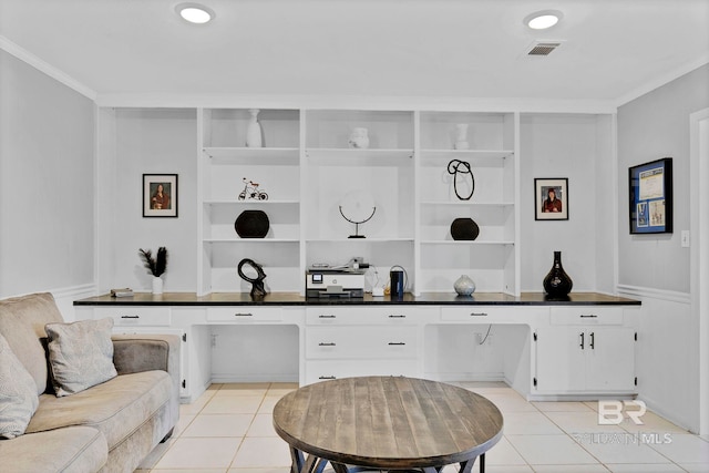 interior space with light tile patterned floors, ornamental molding, visible vents, and built in features